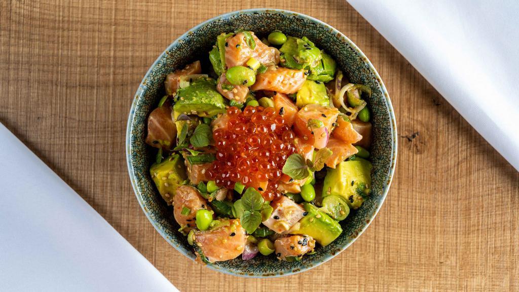 Salmon Lover Bowl · Salmon, edamame, avocado, sesame seeds, sweet onions, and green onions marinated in ponzu sauce topped with ikura and shredded nori served over kahuna rice.