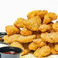 32 Bites · 32 pieces of oven baked crispy chicken bites seasoned with your choice of dust and served wi...