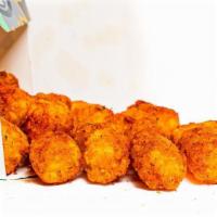 Tyga Tots · A full sized order of bite sized pieces of fried potato seasoned with your choice of dust & ...