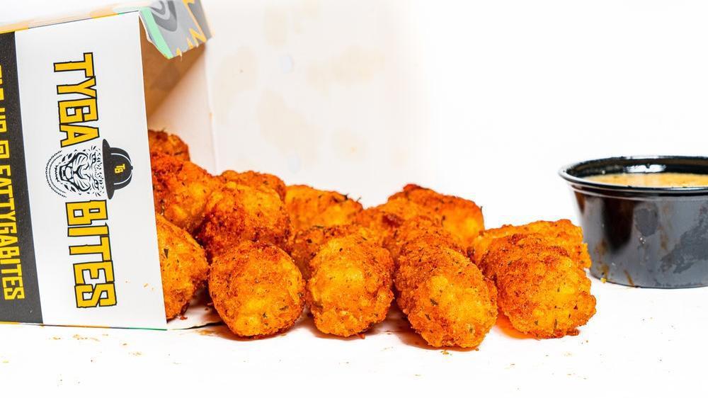 Tyga Tots · A full sized order of bite sized pieces of fried potato seasoned with your choice of dust & dip