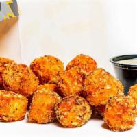 Sweet Potato Tyga Tots · A full sized order of bite sized pieces of fried sweet potato seasoned with your choice of d...