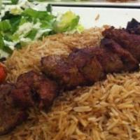 Seek Kabab · Charbroiled leg-of-lamb marinated in a puree of garlic, onions and sumac. Served with okra a...
