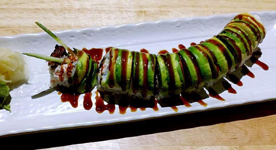 Caterpillar Roll · Eel and Imitation Crab and Cucumber inside, Topped with Avocado and Tobiko