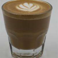 Cortado · Equal parts of a double espresso shot with steamed milk