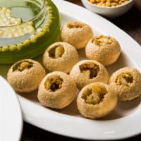 Pani Poori · Freshly prepared crispy deep-fried pastry stuffed with flavored masala water. Served with a ...