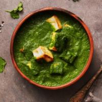 The Saag Paneer · Freshly prepared mixture of cottage cheese and spinach curry.