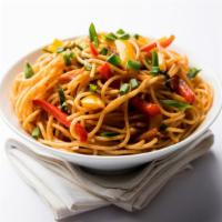 The Veg Chow Mein · Freshly prepared stir fry noodle dish served alongside seasonal vegetables.