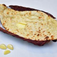 Garlic Naan · Yummy crispy traditional bread with garlic on top.