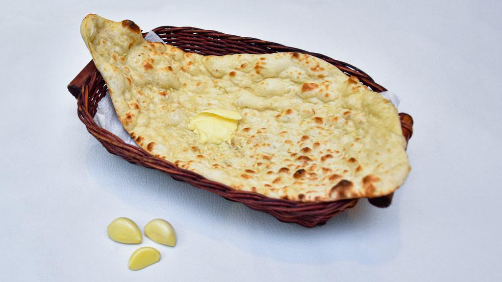 Garlic Naan · Yummy crispy traditional bread with garlic on top.