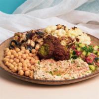 Vegan Deluxe Platter · Falafel served with Hummus, Baba Ganoush, Dolmas, Tabouleh, Rice, Salad, Pita, and Tahini.