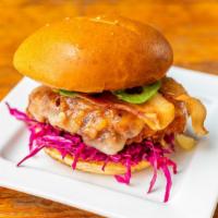 Cluck's Spicy · Signature house brined and breaded chicken breast, chipotle aioli, red cabbage, bun.