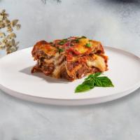 Meat Sauce Lasagna · Thin layers of pasta with spaghetti sauce, melted cheese and ground beef.