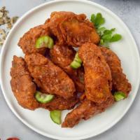 Hot Wings  · Fresh chicken wings breaded, fried until golden brown, and tossed in hot sauce. Served with ...