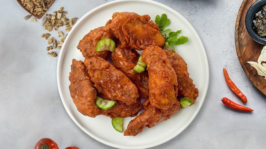 Hot Wings  · Fresh chicken wings breaded, fried until golden brown, and tossed in hot sauce. Served with a side of ranch or bleu cheese.