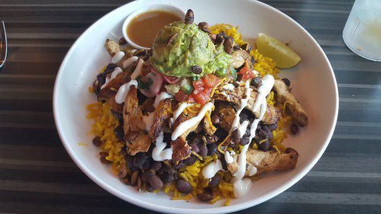 Mexican Bowl · Choice of meat, rice, refried beans, sour cream, guacamole, cheese, onions, cilantro, mild salsa, side of chips. Steak, chicken, pastor, carnitas, chorizo.