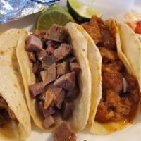 Meat Tacos · Choice of meat, topped with onions, cilantro, sides of mild salsa, radishes, and lime. Meat ...