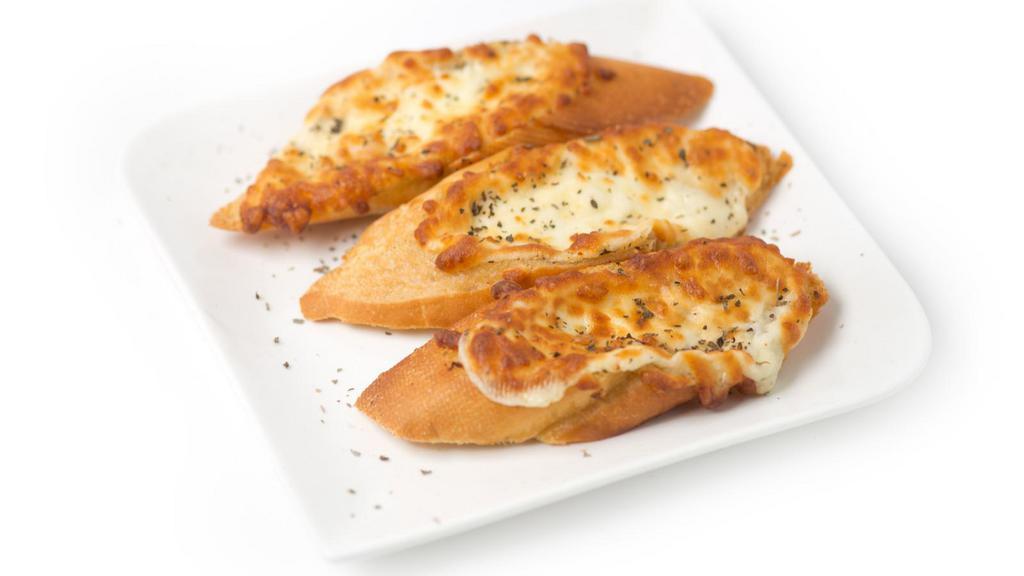 Garlic Bread with Cheese · Fresh baked garlic bread topped with warm mozzarella cheese.