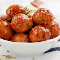 Meatballs · Housemade meatballs topped with marinara sauce and warm mozzarella cheese.