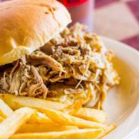 Pulled Pork Sandwich · Served with lettuce tomato and onion.