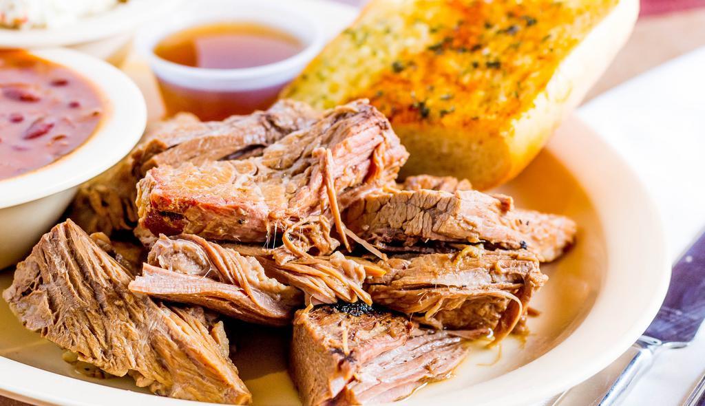 Texas-Style Brisket · Served with two sides and garlic bread.