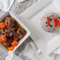 Oxtail Served with Rice & Bean · Oxtail stew with white rice mixed with red beans.