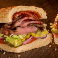 Tri Tip Sandwich · Delicious grilled tri tip steak with sauteed onions, swiss cheese on a toasted roll with let...