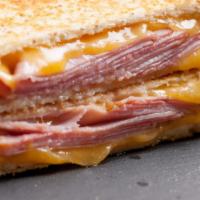 Grilled Ham & Cheese · Grilled sourdough bread, Black Forest Ham with a combination of shredded Cheddar/Jack cheese.
