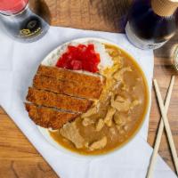 JAPANESE KATSU CURRY RICE · - Pork cutlet Japanese Curry over rice served with red pickles.