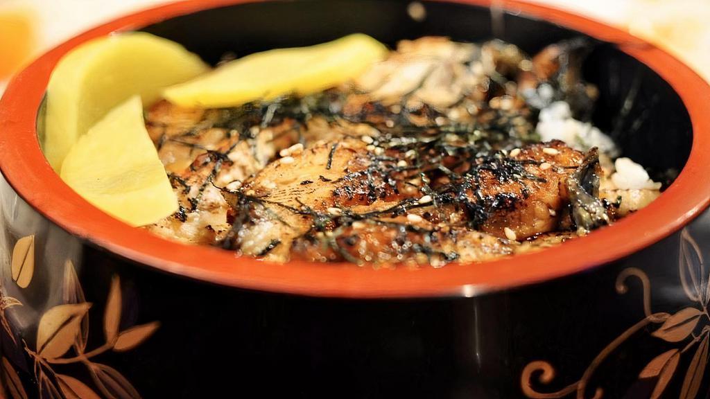 UNAGI DON · - Eel over rice with homemade unagi sauce, Japanese yellow radish, shredded dry seaweed, and sesame seed.