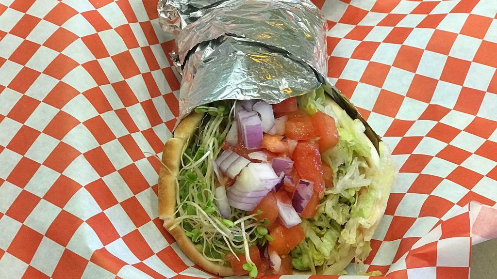39. Veggie Tale Wrap · Veggie pita pocket: avocado, sprouts and hummus with shredded lettuce, tomatoes and red onion