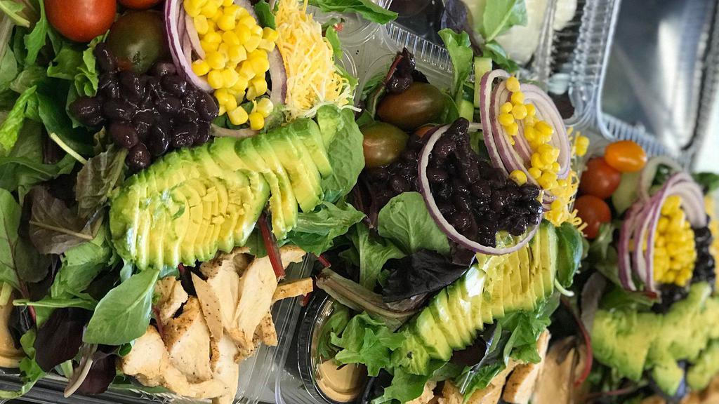 47. Southwest Salad · Romaine & mixed greens w/ avocado, corn, black beans, shredded cheese, cucumber, tomatoes, red onions with creamy chipotle-lime dressing