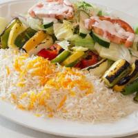 Vegetarian Kabab · A skewer of fresh vegetables (bell peppers, onions, zucchini, tomatoes, and eggplants), barb...
