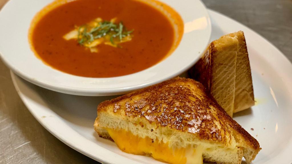 Tomato Basil Soup Bowl · Served with an artisan grilled cheese sandwich on thick brioche.