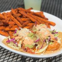 Grilled Shrimp Tacos · Cajun shrimp, pico de gallo. Chipotle aioli, avocado crema, cotija cheese.