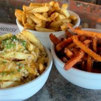 Garlic Fries · House-made Kennebec potato fries tossed in our house garlic seasoning and topped with parmes...