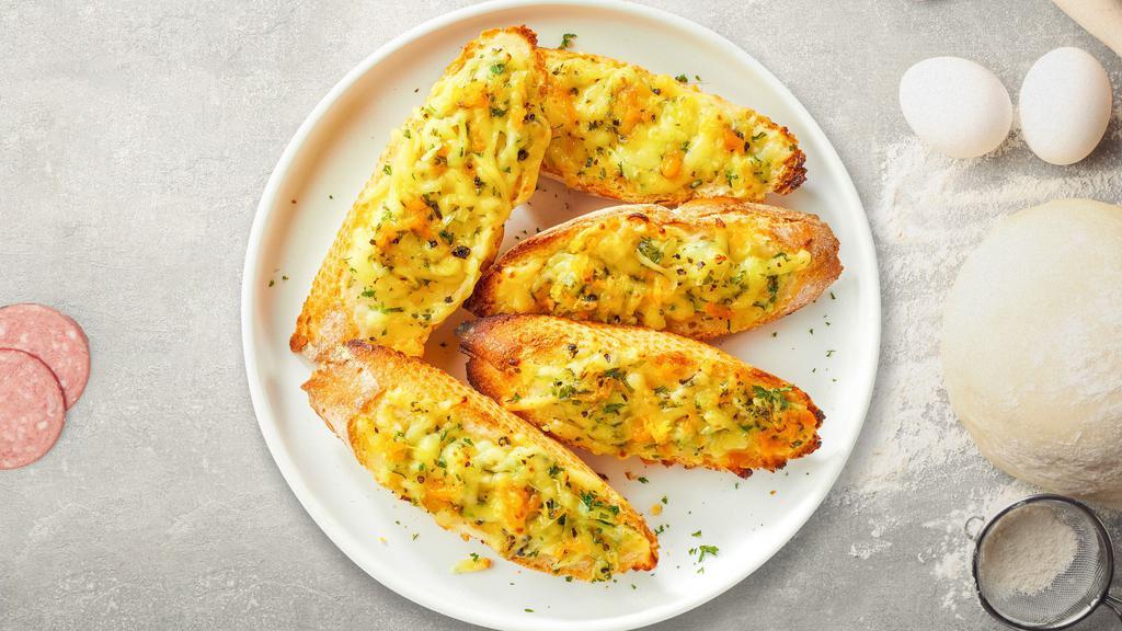Cheesy Garlic Bread · (Vegetarian) Housemade bread toasted and garnished with butter, garlic, mozzarella cheese, and parsley.