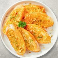Garlic Bread · (Vegetarian) Housemade bread toasted and garnished with butter, garlic, and parsley.