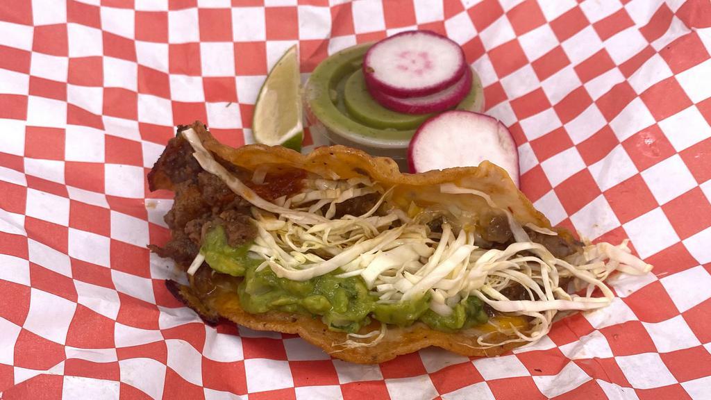 Que Rico! Taco · Our que rico taco is a cross between the vampiro taco and quesabirria! It is so mouth watering with a spicy twist. It is made on a tortilla dipped in our spicy oil, grilled on our griddle with melted cheese, carne asada, salsa, and topped with cabbage and guacamole. It's spicy, but not too spicy. Each taco just.