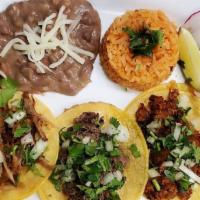 THREE (3) Street Tacos with Rice and Beans · Our delicious street tacos topped with onions and cilantro with a side of rice and beans. Nu...