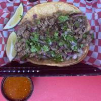 Large Taco: Carne Asada (Steak) · A large tortilla with the meat of your choice topped with onions and cilantro.
