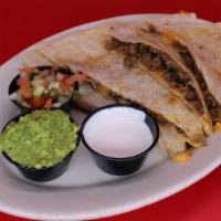 Steak Super Quesadilla · Your choice of meat on our large flour tortilla with melted cheese served with guacamole, so...