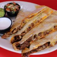 Al Pastor Super Quesadilla · Your choice of meat on our large flour tortilla with melted cheese served with guacamole, so...