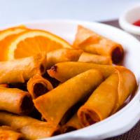 Lumpianitas · Pork, shrimp and vegetables spring rolls sauteed wrapped and fried.