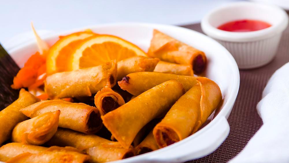 Lumpianitas · Pork, shrimp and vegetables spring rolls sauteed wrapped and fried.