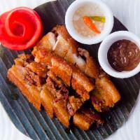 Lechon Kawali · Pork belly cutlets twice cooked and served with lechon sauce.