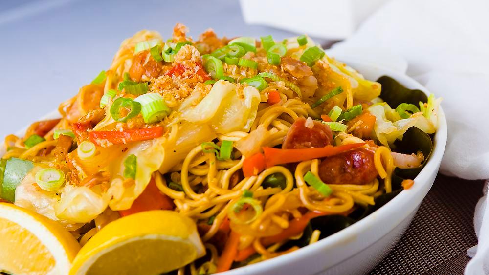 Pancit Combination · Bihon and Canton noodles with chicken, shrimp, sausage & vegetables