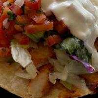 Fish Taco · Sea bass, pico de gallo, sour cream, guacamole and salsa.