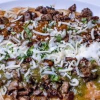 Huaraches · Big corn tortilla, beans, meat, cilantro, onions, salsa, cheese and sour cream.
