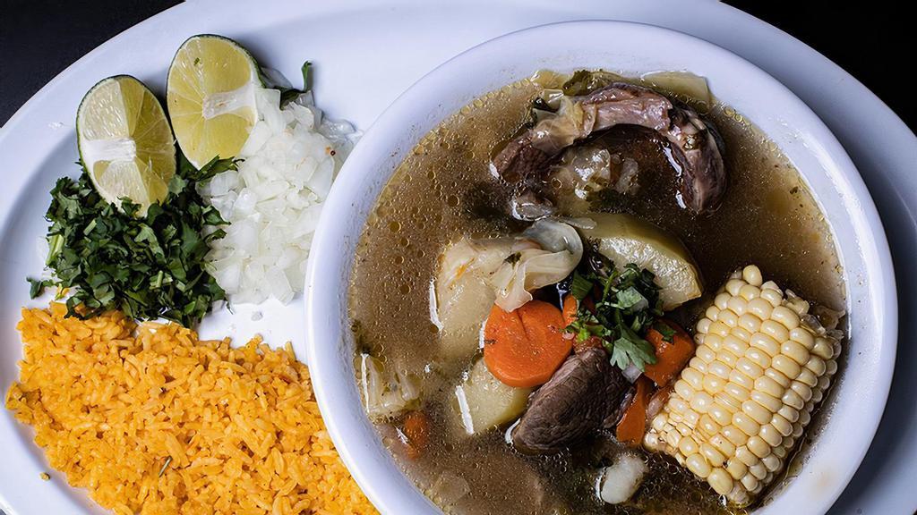 Caldo de Res / Beef Broth · Served with carrots, corn, meat, celery, zucchini, squash, rice and tortillas.