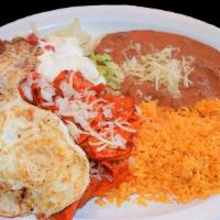 Chilaquiles on Salsa · Red and Green Chilaquiles with rice, beans, red or green salsa.